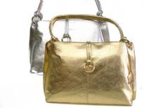 Shiny Genuine Leather Handbag with Shoulder Handle & clasp over the zipper closure.