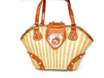 Wicker Flap Tote assembled with double shoulder straps made with metalic hardware. 