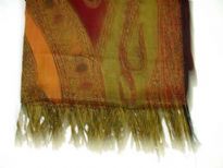 Multi Colored 100% Pure Wool Jamawar Shawl with shades of green, red & orange. Threads like fringes on the edges of the shawl. Imported.