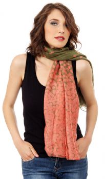 A duo of complementary hues dramatically shade this lightweight polyester scarf patterned with always-classic polka dots. Dense polka dots on one end of the scarf gives an edge to this essential scarf.
