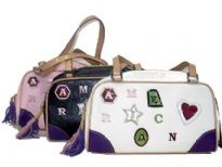 Designer Inspired Handbag has embellished letters, top zipper closure, and a double handle. Made of faux leather.