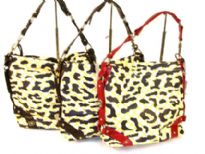 Designer Inspired Shoulder Bag has a squared design featuring a top zipper closure and a single strap. Bag has an animal print patter design and a single color belted frame. Made of faux leather.