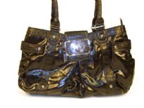 Designer Inspired Handbag has an animal print pattern along straps and shiny leather like texture. Bag has a top zipper closure and belt flap with a twist lock closure. Bag has a double handle. Made of PU (polyurethane).