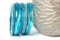 This 14 piece set of hand crafted bangles have skinny as well as wide cuff bangles in resin material. Each bangle has its own etched design or is plain & simple. Lightweight & stylish set of fashion bangles can be matched with lot of outfits.