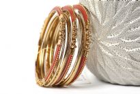 Beautifully hand crafted 9 pieces set of stylish bangles includes 3 rust colored resin bangles encrusted in gold colored metal frame & 6 skinny bangles either etched or plain. Rich color of these bangles makes them attractive. 