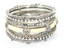 Beautiful & trendy 8 pieces fashion bangles set has white beads 3 thin bangles, 2 mirror pattern bangles, 2 metal patterned bangles & one ivory resin bangle inside a metal frame. This bangle set can be matched with any kind of casual or formal outfit.