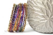 This colorful fashion bangles set of 11 pieces includes 3 metal floral pattern bangles, 2 broad purple resin bangles & 6 shaded thin bangles. 