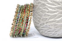 Bohemian Gold Metal Fashion Bangles Set in assorted designs. Set includes 2 metal floral pattern bangles, 6 wavy pattern bangles with green beads, 3 thin multi colored bangles & 2 thin gold bangles. Colorful set can be matched with number of outfits & are very lightweight. 