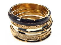 Very beautiful & trendy 11 pieces set includes one wide black bangle, one metal patterned bangle, 2 painted bangles, 3 thin gold colored bangles, 3 thin black beads bangles & 1 floral pattern bangle. Hand crafted in India.