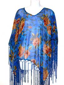 Blue colored 100% rayon material poncho top with orange & green colored floral print. Long hanging threads like fringes on the hem of the top. Imported. 