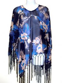 Blue Floral Print Rayon Poncho in Navy color with long hanging fringes along its border. Imported. 