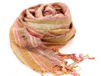 Mocha colored open weave 100% viscose scarf with tones of orange & pink. Twisted long fringes on the edges completes this pastel scarf. Imported. Hand wash.
