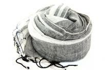 Vertical Stripes in different sizes pattern over this 100% linen scarf which is little stiff & semi-sheer. Black color is woven into white & twisted fringes on the ends of the scarf. Imported.