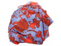 This periwinkle blue 100% silk scarf has garden inspired print in red. Very lightweight & soft to use. Made in India.
