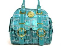 Metallic PVC Fashion Handbag has two front pockets embellished with belted accents. Top zipper closure, double shoulder handle & side pockets also.