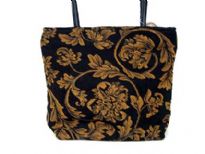Floral Pattern in Gold over this Black Jacquard Shoulder Bag which has double handle & top zipper closure. Lightweight & very durable to use. Made in India.