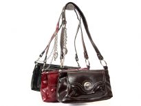 Leather look shoulder bag has a single strap, a top zipper closure and an outside pocket with a twist lock. R-64 PVC Material