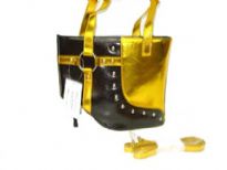 Metallic Boot Bag with studs has a top zipper closure, a double handle and a detachable single strap. Made of PU (polyurethane).