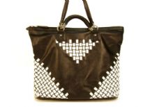 Faux Leather stylish shoulder bag with boxy pattern in white on the corners as well as below the handle. Top zipper closure with small handle as well as shoulder strap. 
