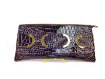 Croco embossed PVC clutch Bag has metal details and a magnetic closure and a an inside zipper closure.