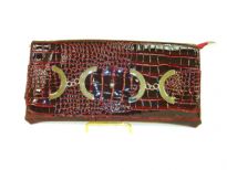 Croco embossed PVC clutch Bag has metal details and a magnetic closure and a an inside zipper closure.