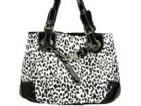 Leopard printed tote bag has a double handle, a top zipper closure and a drawstring detail. Made of PVC.