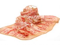 Mocha colored sheer & lightweight scarf with beautiful red print pattern in paisleys, leaves & flowers. 60% polyester and 40% silk. Imported. Hand wash.