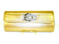 Fashion Clutch Bag has a glossy texture and a studded logo. Magnetic closure. Made of PVC.