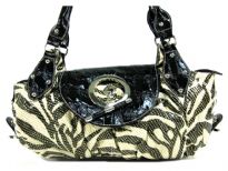 Designer Inspired Metallic Zebra Print Shoulder Bag with large toggle closure on top & also has a zipper closure. Double handle bag is made of PU (polyurethane).