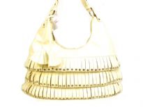 PVC fashion Hobo Handbag has studded details has a metallic texture, a top zipper closure, and a single strap. Made of faux leather.