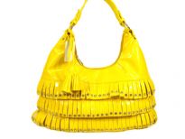 PVC fashion Hobo Handbag has studded details has a metallic texture, a top zipper closure, and a single strap. Made of faux leather.