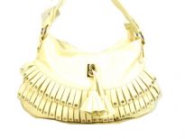 Fashion shoulder bag has a top zipper closure, a single strap and layered frill in same fabric with studded details on it. Made of PVC.