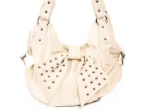 Fashion Hobo bag has a top zipper closure, a double handle and a studded bow detail. Made of faux leather.