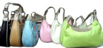 Lightweight handbag for your every use has a touch of sparkle along closure. Bag has a single strap, a top zipper closure and outside pocket with zipper closure. Made of faux leather.