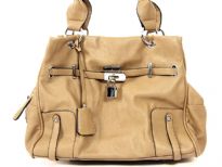 Fashion Handbag has a double handle, a top zipper closure and a belt and lock detail. Made of PU (polyurethane).
