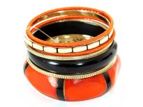 Beautiful orange with black & gold tone 7 piece bangles set has hexagon shape wide cuff worn out look orange bangle, one thick black resin bangle, boxy pattern gold bangle, 2 orange fabric bangles & 2 gold bangles.