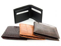 Carry your money in style. This is a Crocodile embossed genuine cow leather bifold mens wallet. The outside shell is genuine cow-hide leather and the inside is faux leather. As this is genuine leather, please be aware that there will be some small creases and nicks in the leather but the wallet are all brand new. 
