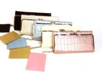 Metallic croco embossed Tri-fold Ladies Wallet has a metallic frame and a twist lock closure. Made of PU (polyurethane)