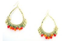 Golden earrings with red beads