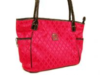 Fleur De Liz Licensed Jacquard Handbag. This spacious broad bag with two side pockets with button closure has leather trim bordering the bag & has double handle. 