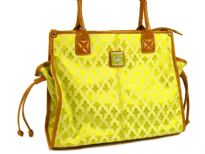 Fleur De Liz Licensed Jacquard Handbag. This spacious bag in jacquard material has leather trim bordering the bag & also hanging tussles on the sides. Top zipper closure.