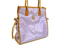 Fleur De Liz Licensed Jacquard Handbag. Double Handle & top zipper closure in leather. Two side pockets outside the bag with hanging leather strands & outside zipper pocket. Leather trim borders the bag.