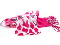White & Fuchsia Cow Print 100% Viscose Scarf with Fuchsia & Pink Colored Ends. Twisted fringes on the ends. Lightweight and very soft to use. Imported. 