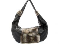 Faux Leather Studded Shoulder bag. This one piece bag has golden studs in the middle of the bag as well as on single shoulder strap. Top zipper closure.