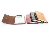 Alligator embossed business card holder. Magnetic snap closing.