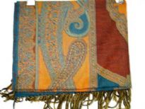 Teal colored 100% pure wool Jamawar shawl with shades of red & orange also. Artistically patterned with paisley shapes. Fringes on the edges. Imported.