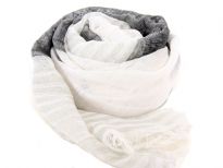 White & black colors alternate horizontally on this sheer 100% polyester scarf with stripes pattern on it. Eyelash fringe all around the scarf. Imported. Hand wash.