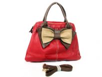 Bow accent dual compartment fashion handbag.  Adjustable shoulder strap included. Back zipper pocket.