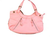 Designer Inspired Shoulder Bag with a round top, side open pockets and zipper details in the front. Top zipper closure and a double shoulder handles. Made of PU (polyurethane).