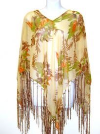 Gold colored 100% rayon material V-Neck poncho top with brown & green leafy print with long hanging satin threads at its edges. Imported.